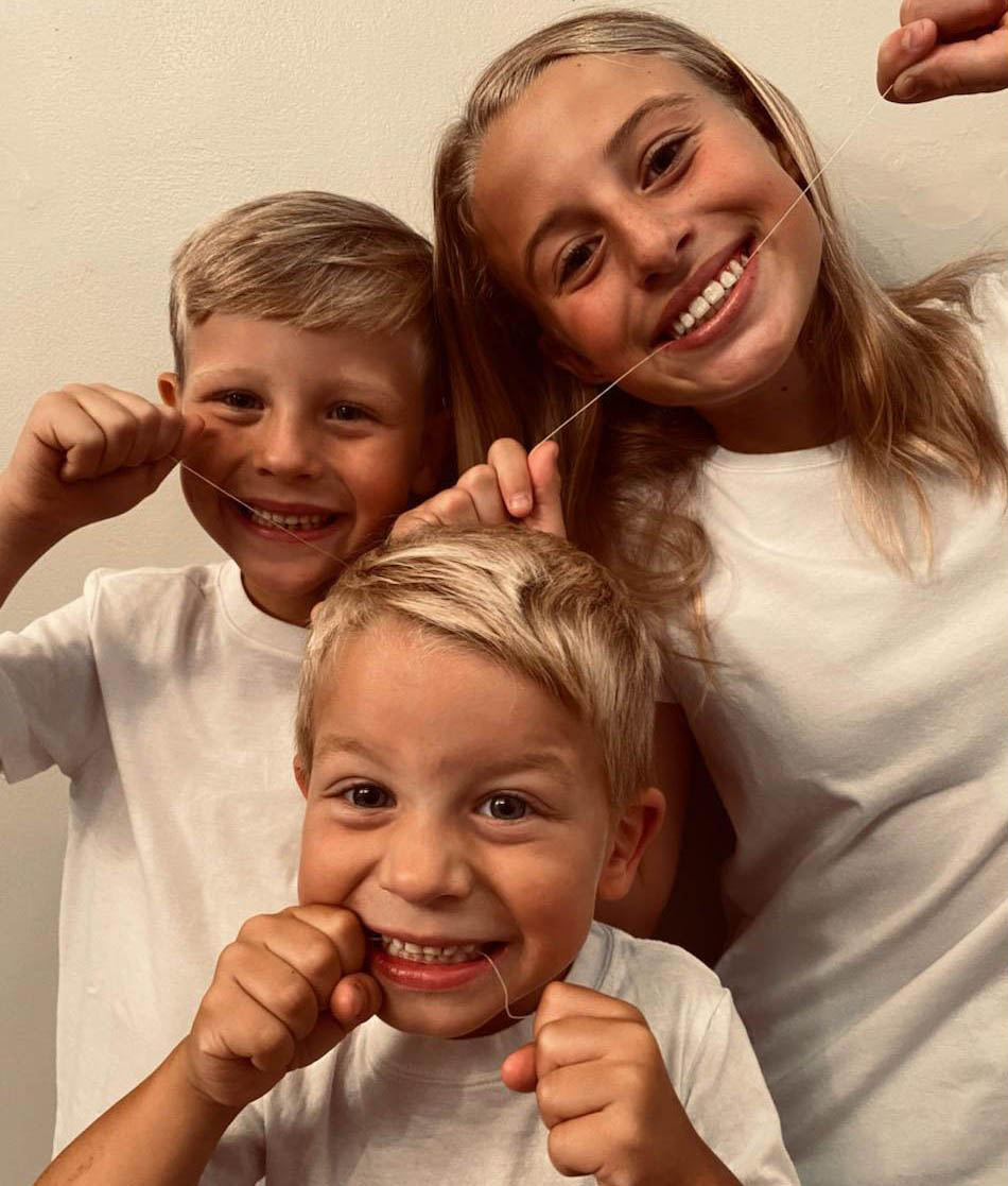 3 Children Flossing